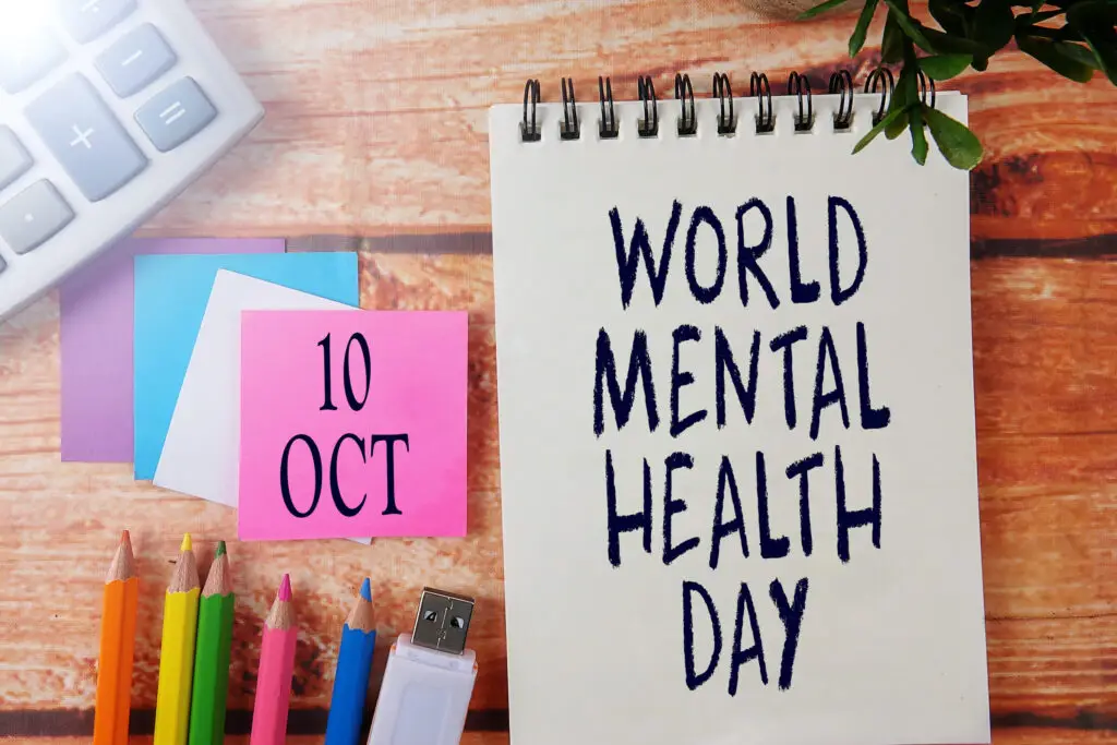 INTERNATIONAL EVENT CALENDAR CONCEPTUAL : WORLD MENTAL HEALTH DAY , 10 Oct with background of office stationeries.