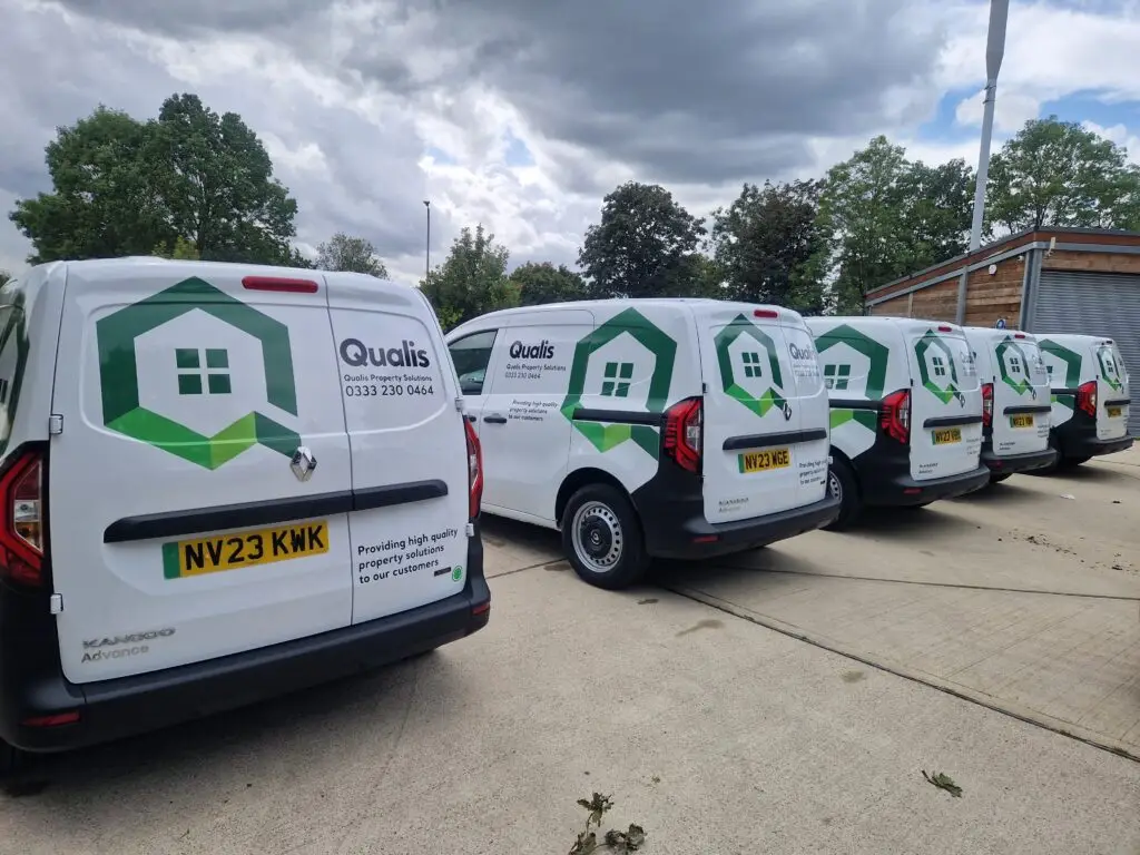 Group of small qualis branded vans