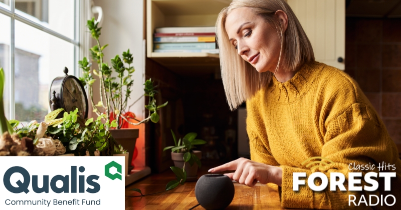 a woman listening to the radio in her kitchen