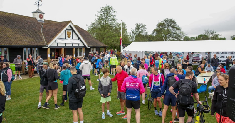 runners gathered outside matching cricket club